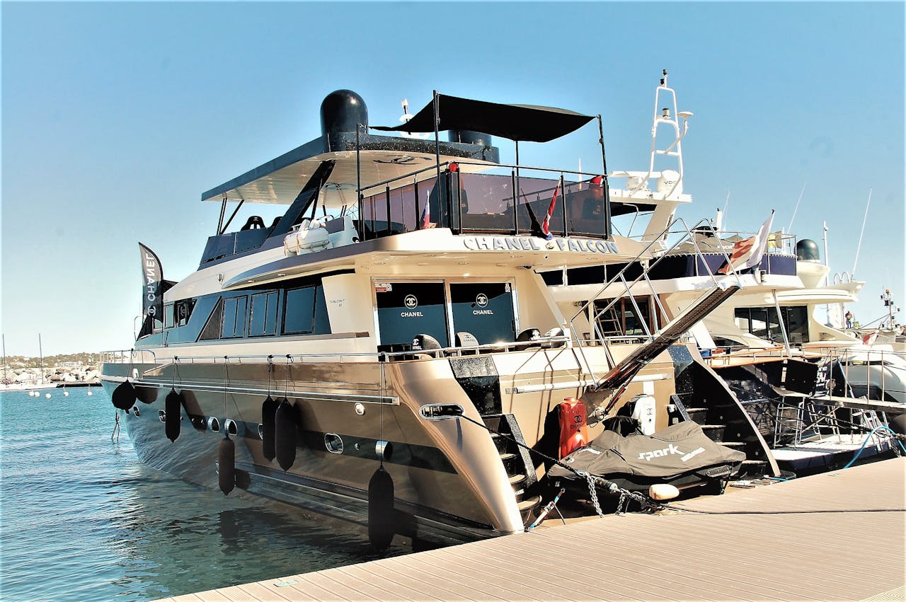 A stunning luxury yacht docked at Saint-Tropez harbor, showcasing elegance and style.